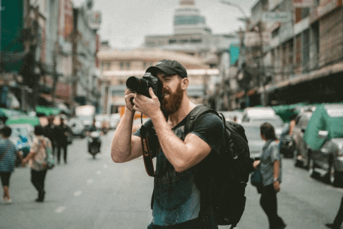 10 Entry-Level Digital Nomad Jobs for Beginners 13 Photographer taking photos in Bangkok