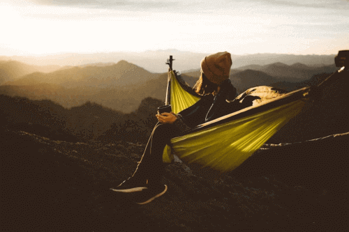 How to Travel When You Have No Money | 7 Hacks for 2025 7 How To Travel When You Have No Money - Girl in hammock