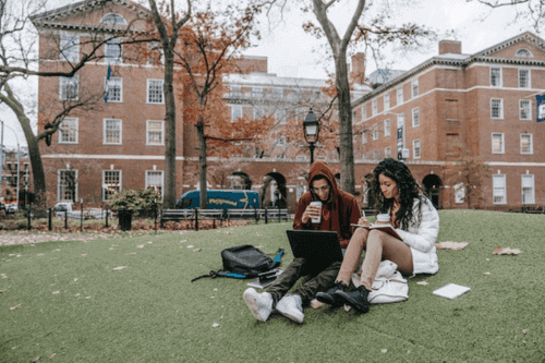 Students outside a university studying the Best Degrees for Digital Nomads