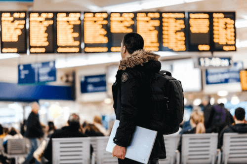 Are Laptops Allowed in Checked Luggage -Guy at airport with laptop